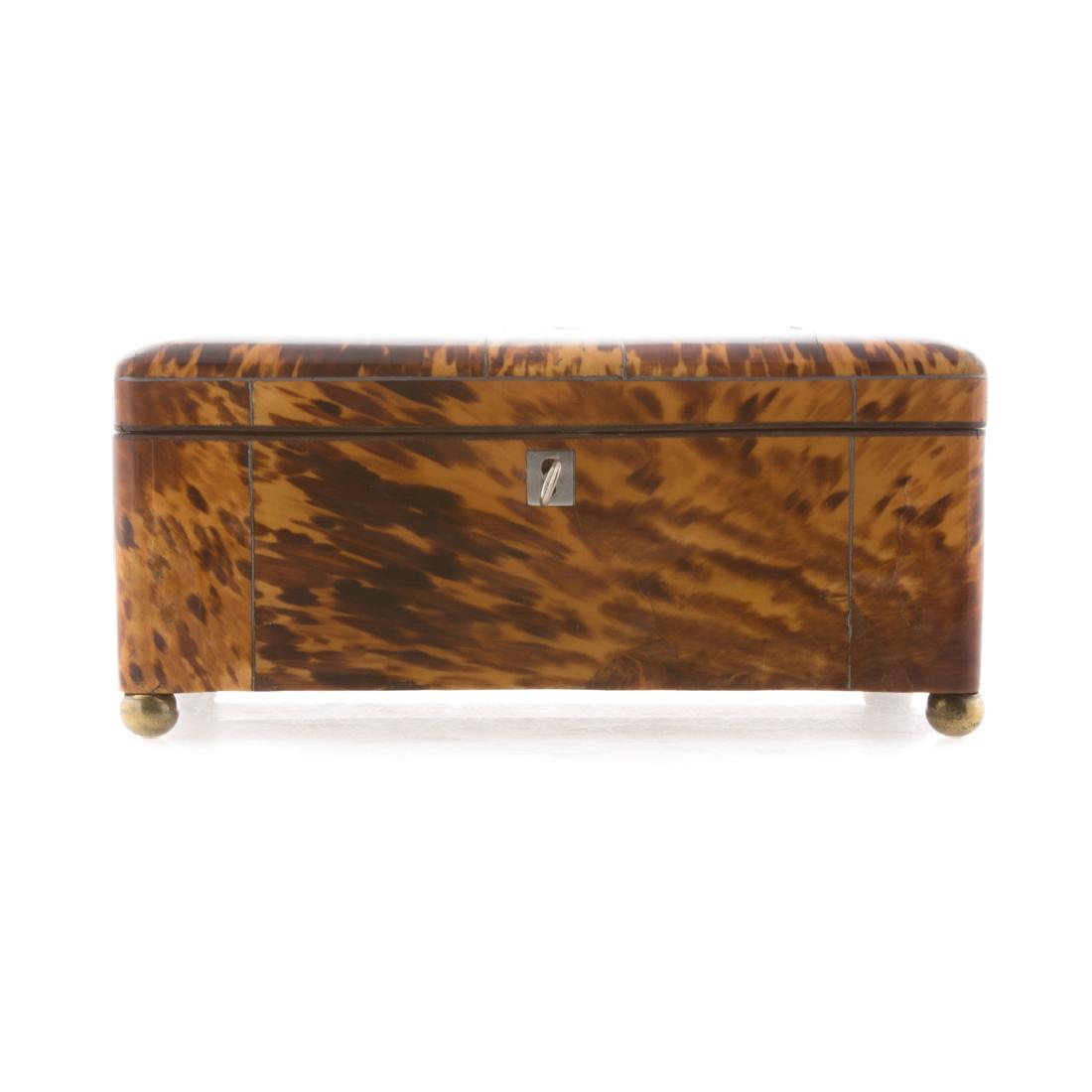 Regency sewing/jewelry box: circa 1815; sewing box now converted to jewelry box with removable interior tray, on brass ball feet, 4 1/2 in. H., 9 1/2 in. W., 6 in. D.