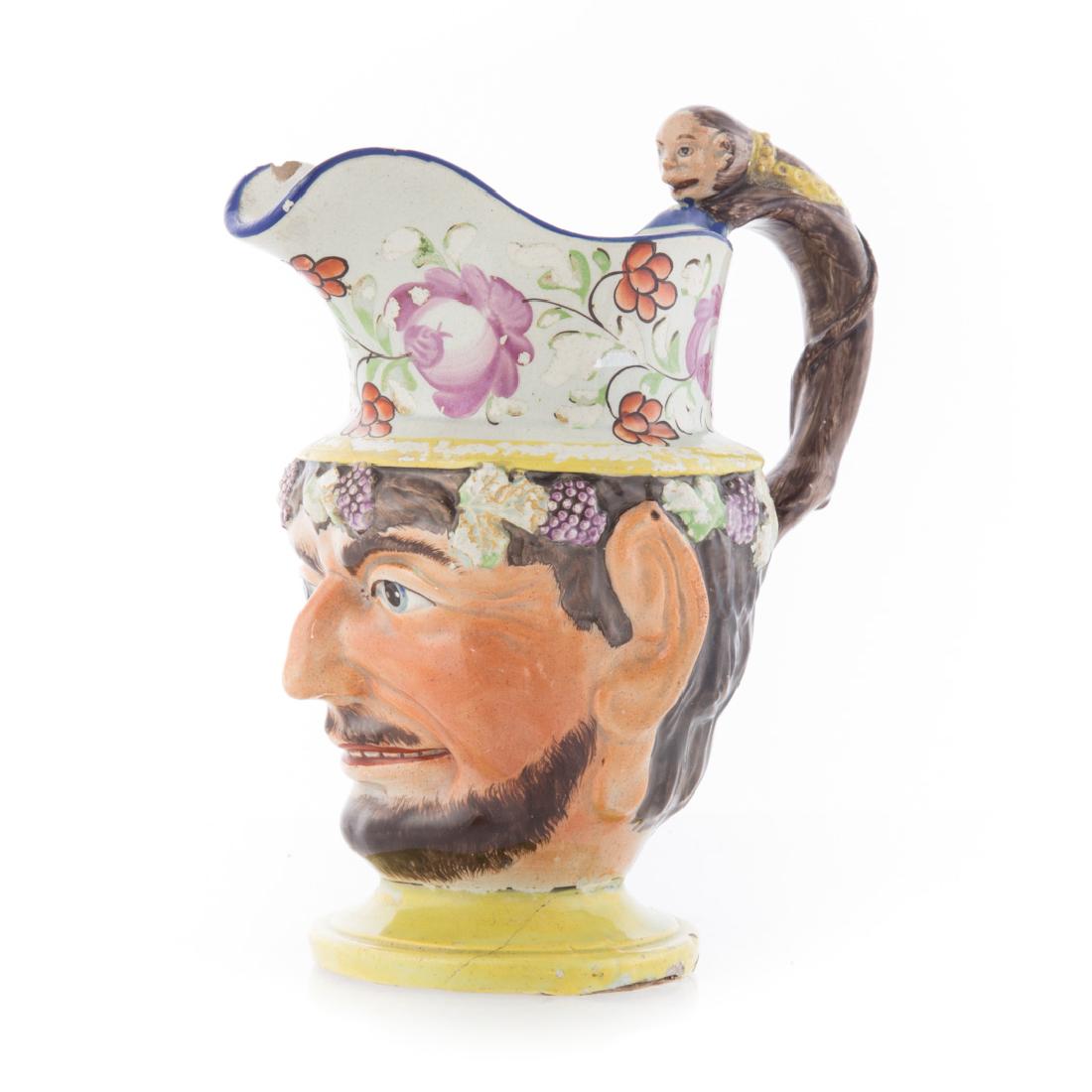 Staffordshire earthenware satyr jug: fourth quarter-18th century; with cabbage rose decoration and monkey handle, 8 in. H.