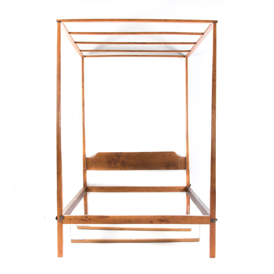 American tiger maple tester bed: New England, late 18th/early 19th century; chamfered tapered posts with arched tester, solid headboard, posts 86 in. H.