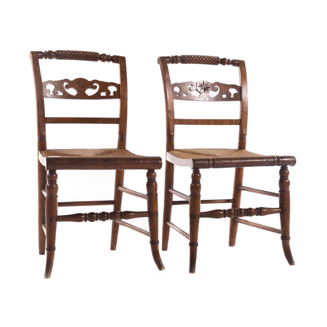 Pair Canadian Regency style maple side chairs: early 19th century; rolling pin crest rails, open worked horizontal splats, rush seats, rounded turned legs connected by stretchers, 33 in. H., 17 in. W., 17 1/2 in. D.