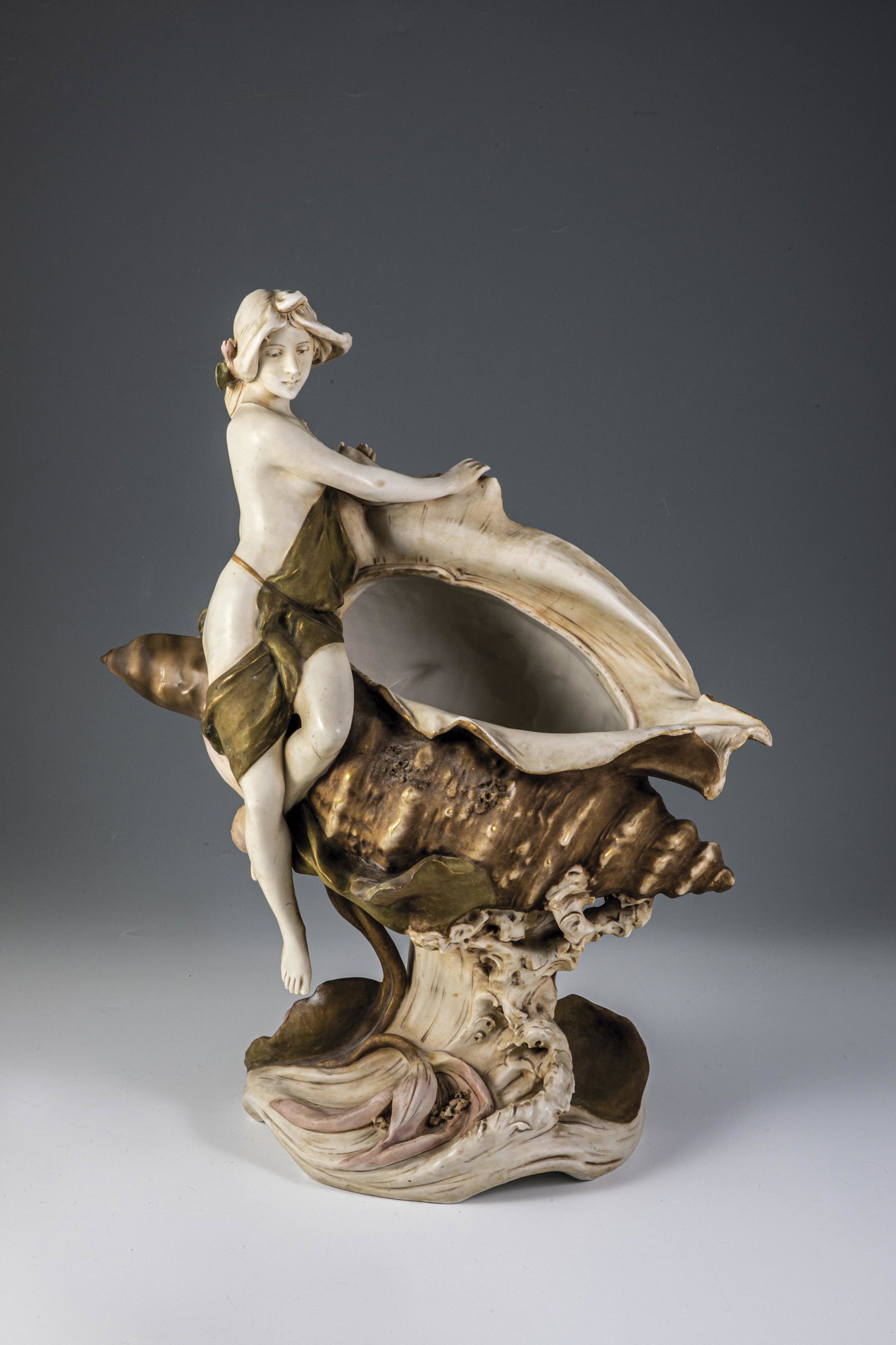 Shell - nymph: Shell - nymph S.H. (design), porcelain factory Eduard Eichler, Dux/Bohemia, 1909 porcelain, colorful on-glaze painting. Left thumb restored. Relief mark, in ligature monogrammed 'SH' and dated 1909. h