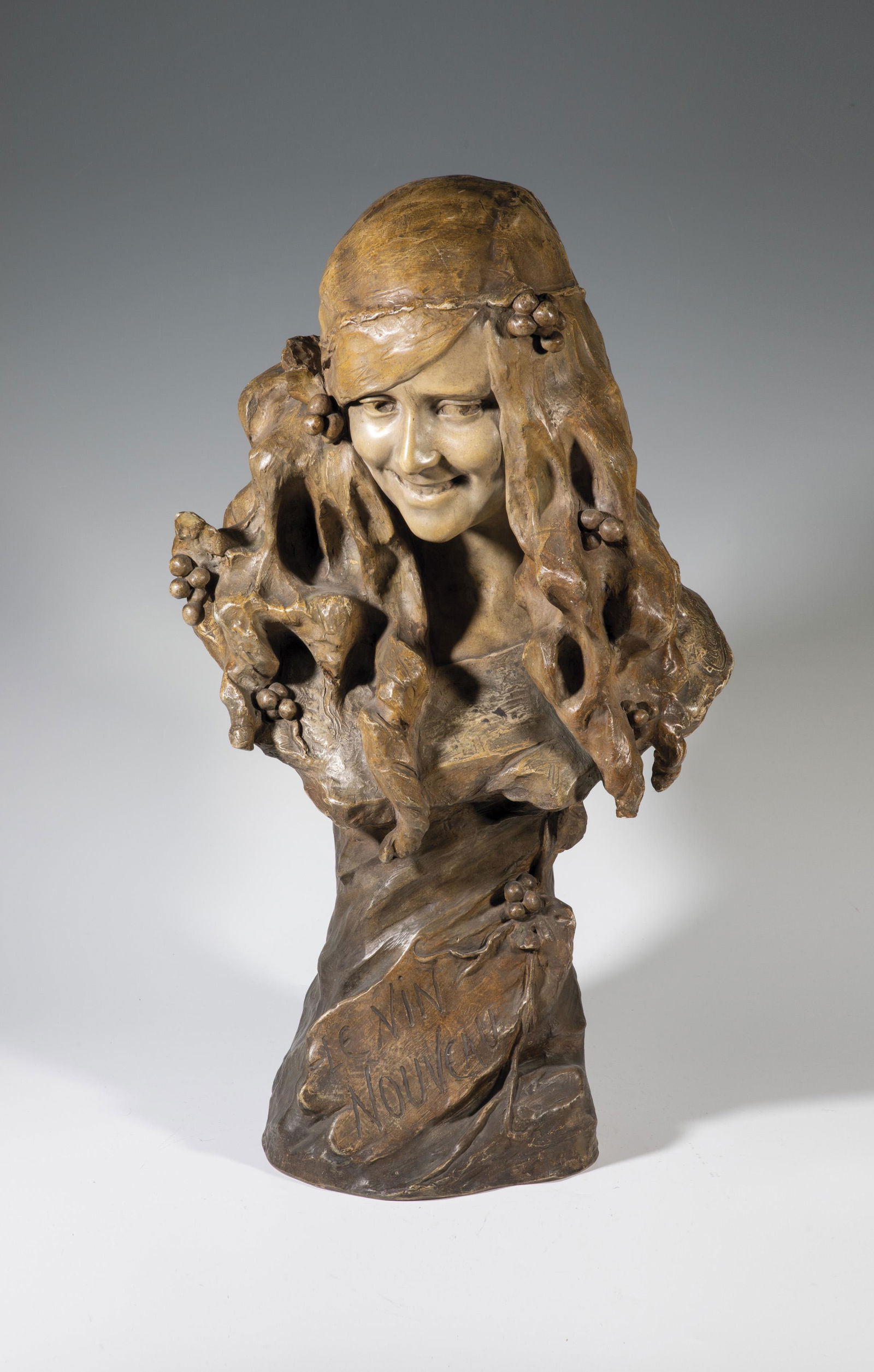 Bust of girl ''Le Vin Nouveau: Bust of a girl ''Le Vin Nouveau'' Ezio Ceccarelli (design), Friedrich Goldscheider, Vienna, c. 1900/01 Terracotta, painted in color. Minor scuffing. Inscribed: Ceccarelli (incised), company mark Sculp