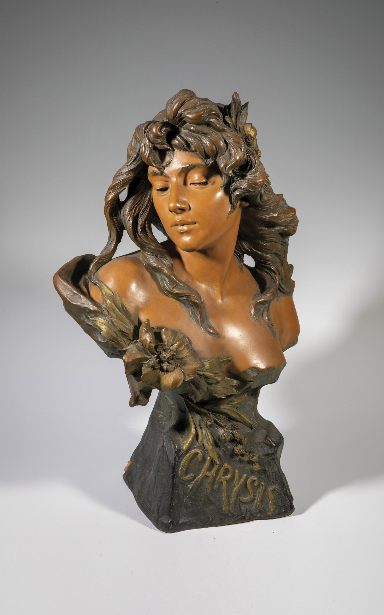 'Chrysis'' (girl bust): 'Chrysis'' (bust of a girl) Alfred Jean Foretay (1861 - 1944) terracotta, colored painted. The edge of the stand is damaged. Inscription: A. Foretay (scratched). Round stamp ''L'ART FRANCAIS''. H. 68