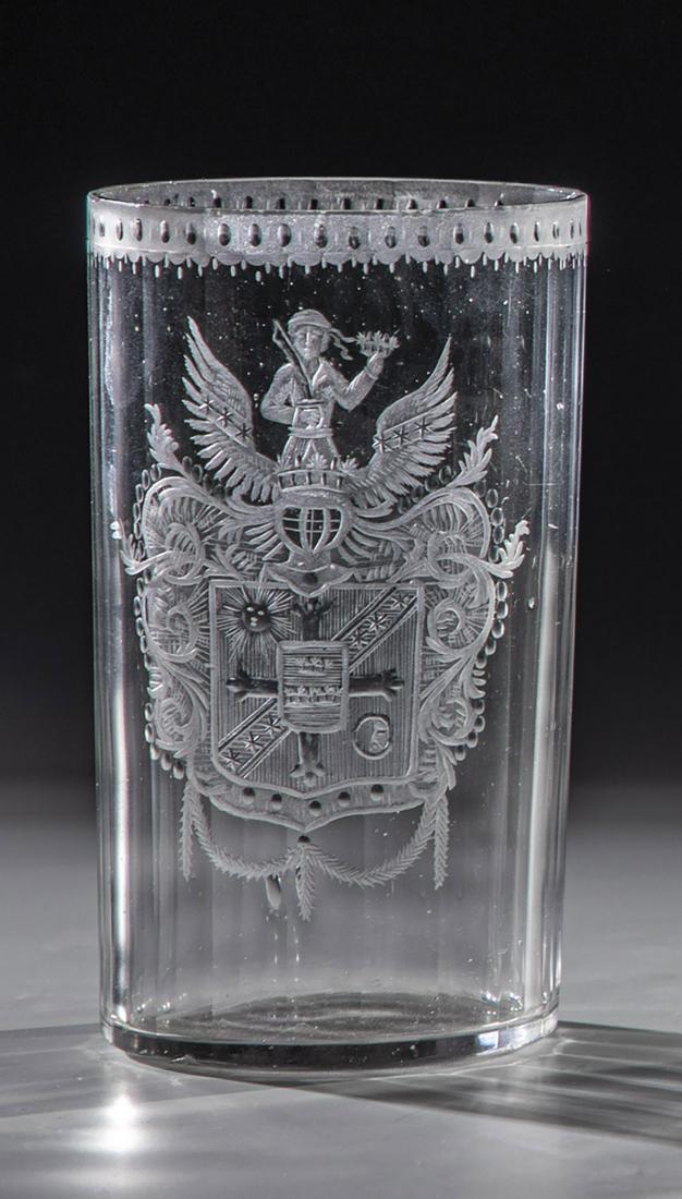 Cylinder mug with coat of arms: Cylinder mug with coat of arms Silesia, 1760 Grayish glass with multiple peeling. Frontal cut, partly polished coat of arms with rich helmet decoration. Below the lip rim matte cut border with blossom