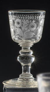 Goblet with floral decoration: Goblet with floral decoration Bohemia, around 1700 Disc base with break-off. Dome with circumferentially cut, partly polished floral branches. H. 16 cm