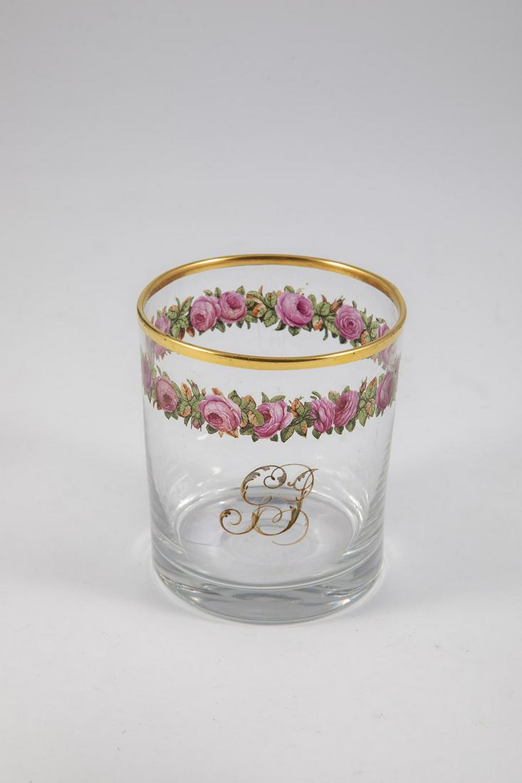 Mug with rose border: Goblet with rose border Bohemia, around 1900 Below the gilded lip rim polychrome and finely painted border with rose blossoms, buds and foliage. Frontal ligature monogram GJ in brown. H. 8,5 cm