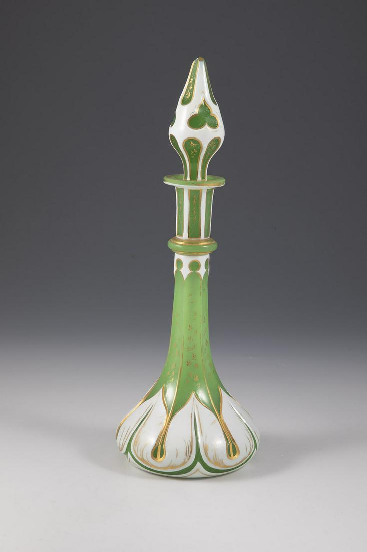 Bottle with stopper: Flacon with stopper Bohemia, c. 1860 Uranium colored alabaster glass, so called chrysoprase glass, with pewter enamel overlay, ornamentally cut, gold decorated. Stopper suitably decorated. H. 30 cm