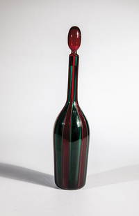 Bottle with stopper ''A fasce: Paolo Venini (design), Venini, Murano, 1956 Colorless glass with red and green glass rods ('a canne'). Marked: venini murano ITALIA (etching stamp). H. 33 cm Lit.: Marino Barovier & Carla Sonego