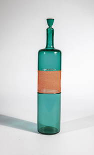 Bottle with stopper ''Incalmo: Paolo Venini (design), Venini, Murano, 1959 Colorless glass with green underlay and orange-red 'mezza filigrana' band, fused in 'incalmo' technique. Original label of the manufactory. H. 38 cm Lit.: