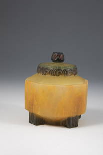 Cover box: Lejan lidded box (design), Amalric Walter, Nancy, c. 1920 Pâte de verre in colorless, yellow, orange, green and violet, molded. On the lid and on the four feet stylized leaf relief. On the wall mar