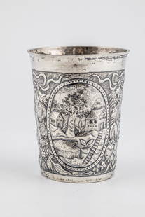 Large cup: Large cup North German, late 17th century silver. On the wall in three oval medallions tree-covered landscapes with houses. Between the medallions fruit bunches and ribbon ornaments. Monogrammed and