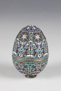 CloisonnÃ© enamel egg dose: CloisonnÃ© enamel egg tin Russia, stamped Khlebnikov silver, gilded inside. The two-part, ovoid wall is decorated with pearl borders and stylized tendril motifs on a hallmarked background.