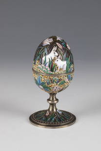 CloisonnÃ© enamel egg tin with foot: CloisonnÃ© enamel egg tin with foot Russia, stamped Ovchinnikov silver, partly gilded. Hinged lid. Ovoider body decorated with two pairs of rabbits between stylized flowering perennials and borders