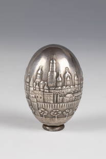 Egg can with Kremlin architecture: Egg tin with Kremlin architecture Russia, stamped Ovchinnikov silver, gilded inside. All-round stylized architectural view. Stamped with Beschaumeistermark ''IL'' with fineness ''84'' and master's