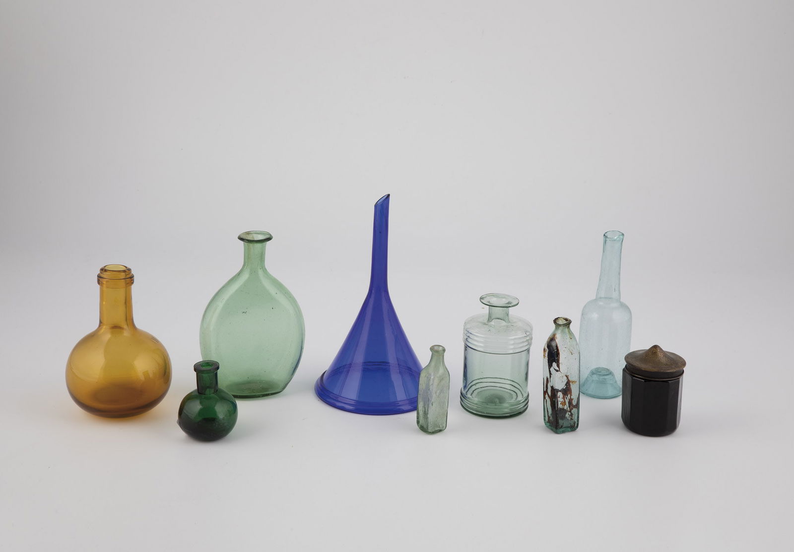 One funnel and seven medicine jars (1 of 1)