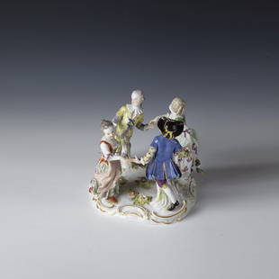 Dancing children's group: Dancing children's group Meissen, ca. 1850, based on a design by Johann Joachim Kaendler A group of two boys and two girls dancing on an almost round rocaille base. On the back with underglaure blue