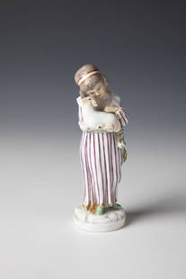 Young Shepherdess: Young Shepherdess Ludwigsburg, 19th Century Standing on a round pedestal with young sheep in her arms. Brightly painted with gold staffage. Damaged. On the back with underglaze blue manufactory mark.