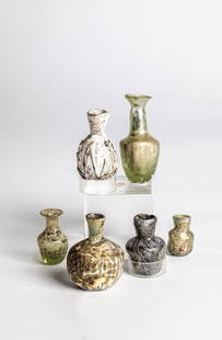 Mixed lot: six excavations: Mixed lot: six excavations in the Middle East, 1st/3rd century Green-tinted or grey-brown marbled glass. Partly soil or water finds. A small bottle with zig-zag glass thread, which is partly chipped.