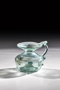 Inkwell: Inkwell Germany, 17th / 18th century Light green glass with tear-off. High-pitched bottom, compressed wall, cantilevered muzzle edge. Appliqued multi-pinched handle. H. 6.5 cm