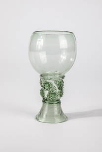 Roemer: Roman German or Netherlands, 17th century Light green glass with spun base, raised bottom with tear, hollow shaft open to the top with staggered berry nubs. Below the bulbous cuppa, pinched thread.