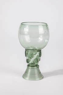 Roemer: Roman German or Netherlands 17th century Light green glass, spun base with tear, upper open shaft with offset applied berry nubs. Thread pinched at the base of the bulbous cuppa. Jump from the edge of