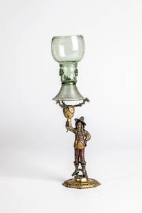 Roemer with Roemer clamp: Romans with Roman ferrule North German or Netherlands, 17th century Olive-coloured glass with tear-off. Flared, spun foot. On the hollow shaft, which is open at the top, three berry nubs, pinched thre