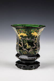 Mug with animals: Mug with animals North Bohemia, ca. 1845 Dark green glass, faceted wall that widens eight times upwards and painted with enamel, gold and silver painting, four seed frames contain a monkey, a parrot,