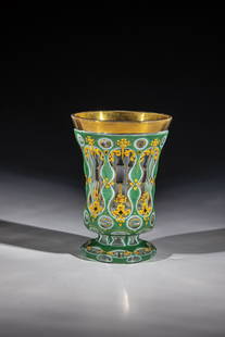 Foot cup with double overlay: Double-cased foot cup Bohemia, ca. 1840 Colourless glass with pewter enamel and green overlay. The base and waisted wall are cut with rich, gold-honed, impasto enamel painting: C-flourishes and