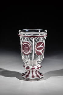 Foot cup with double overlay: Foot cup with double overlay Bohemia, Joachimsthal, Carl Stoelzle after 1835 Colourless glass with pewter enamel and violet agatinopal overlay. Faceted foot with ground ball. Nodus with turban cut. Be