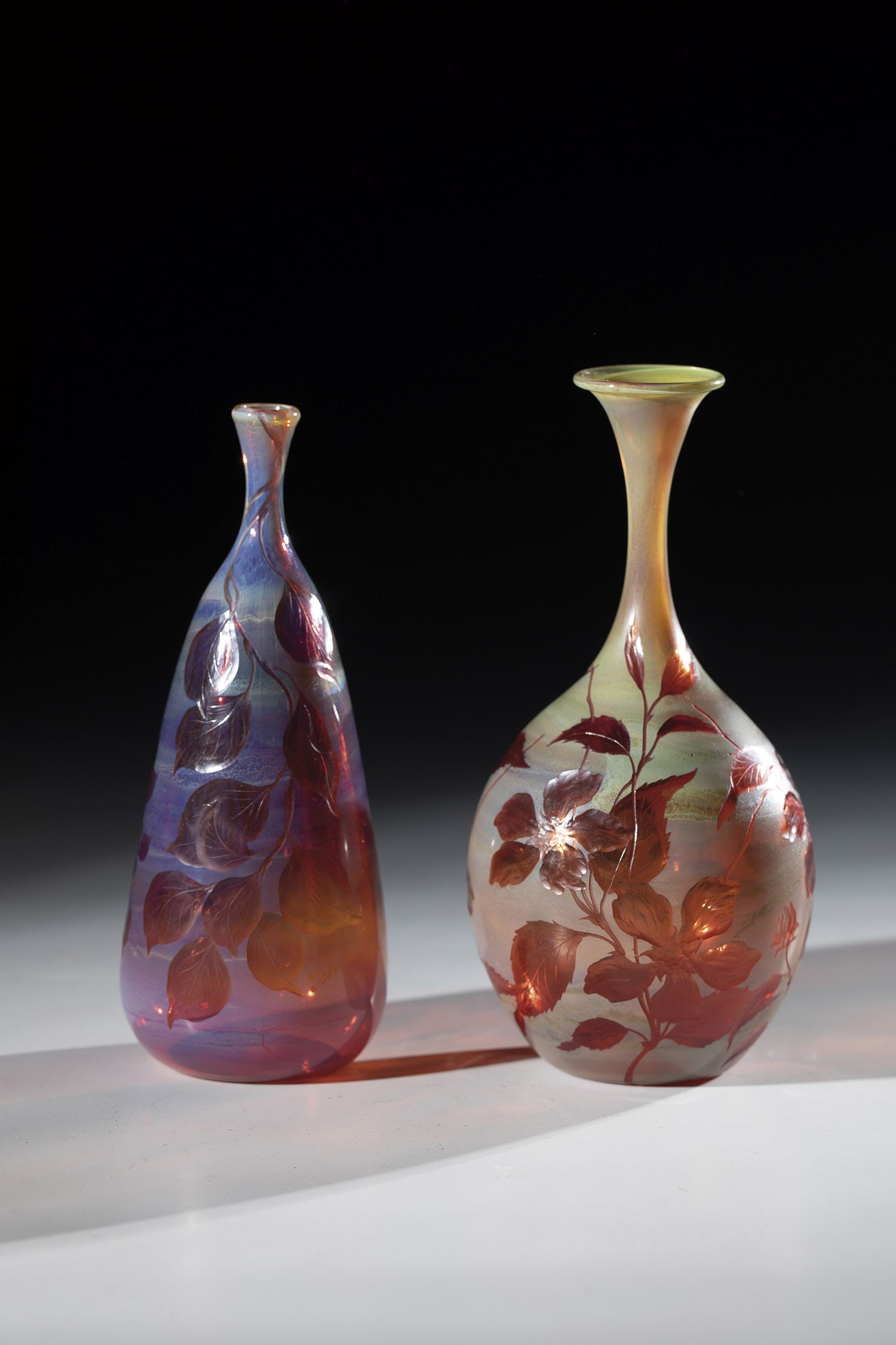 Two small vases: Two small vases of glassblowing Karl and Wolfgang Schmid, Lindberg near Zwiesel, 1981 Lustful glass, blown in front of the lamp, with cut, floral decoration. Signed ''Schmid'' on the wall, ''K. Schmid