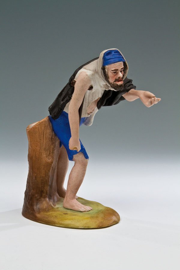 Figürliche Vase in Form eines Bettlers: Figürliche Vase in Form eines Bettlers Moskau, Porzellanmanufaktur Gardner, 19. Jh. Biskuitporzellan. Auf Ovalsockel realistisch modellierte und staffierte Wiedergabe eines Bettler mit zerrissener Kl