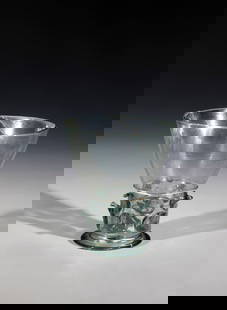 Berkemeyer: Berkemeyer Germany or Netherlands 16th century Light green, thin-walled glass with a raised bottom and demolition. The foot spun. On the wall two rows with five pointed knobs each, above them fine