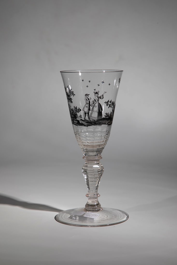 Goblet with Allegory of Eroticism: Goblet with allegory of eroticism Saxony, 18th century, colourless glass. Disc base. baluster shaft and base of the bell-shaped cuppa faceted in many ways. Frontal in black solder painting allegorical