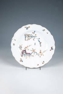 Plate ''Yellow Lion'': Plate ''Yellow Lion'' Meissen, 1760-70 Deeply hollowed, round plate on a standing ring. In the mirror in Kakiemon style based on the Japanese model in fine, polychrome painting, a lion (or striped