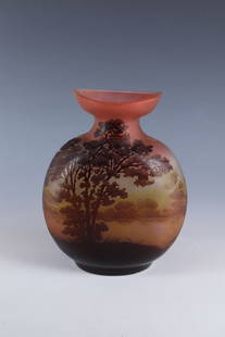 Vase with river landscape: Vase with River Landscape Emile Gallé, Nancy, c. 1906 Colourless glass, partially underlaid with salmon, yellow and violet overlay. Etched decoration in relief all around: river landscape with tree s