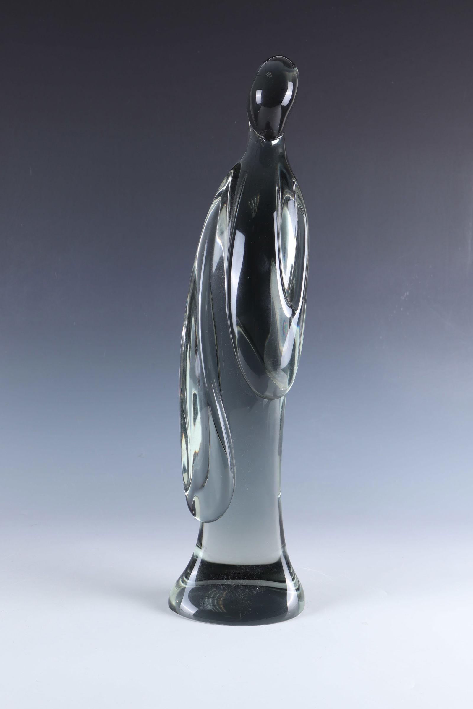 ''Madonna'': ''Madonna'' Ermanno Nason (design), Vetreria Gino Cenedese, Murano, circa 1970 Smoky grey glass. Abstracted depiction of the Madonna, freely formed. Signed underside in diamond crack: E. Nason. H. 52.
