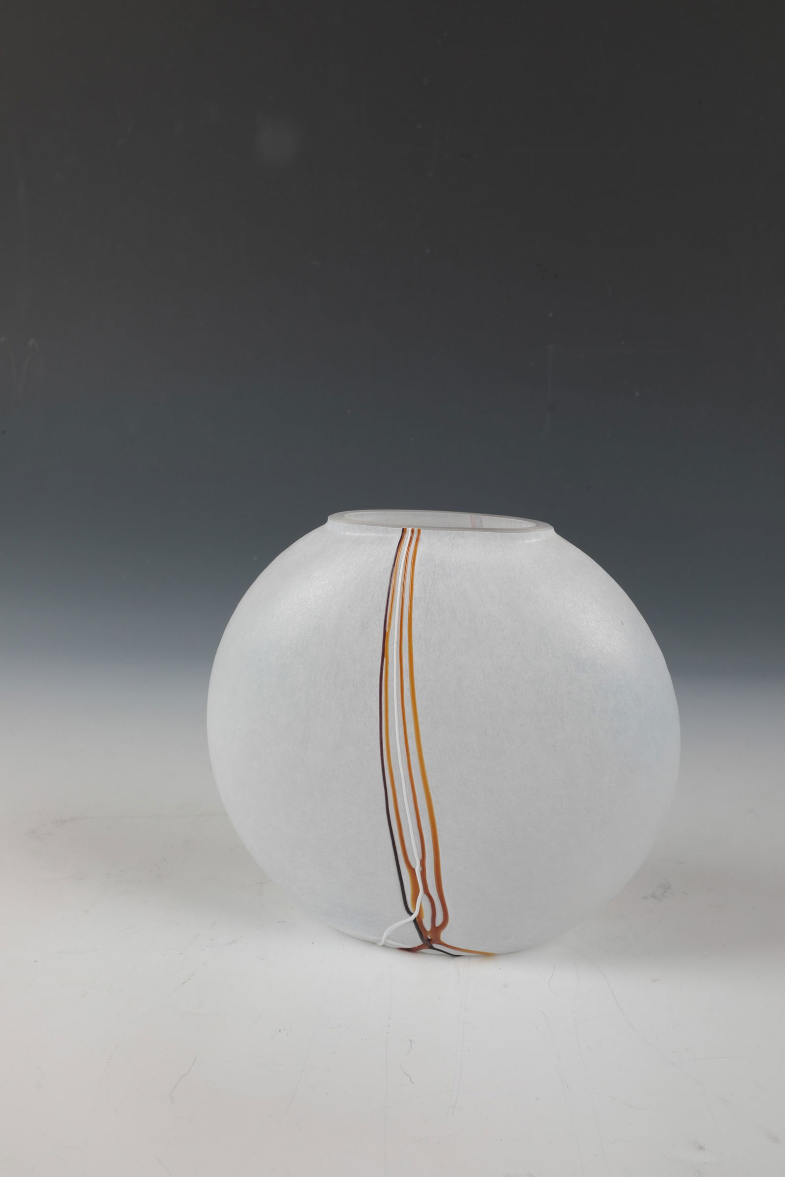 Vase: Vase Bertil Vallien (design), Kosta Boda, Sweden Colourless glass with milky-white crumb melts. On both sides of the wall, vertical glass threads with multi-coloured fused glass. Inscribed and numbere