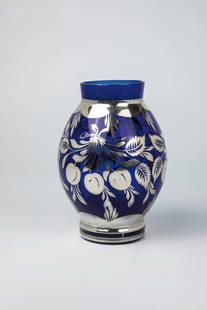 Vase with silver plating: Vase with silver plating, Bohemia, c. 1910 Blue glass with galvanized floral fine silver decoration. Muzzle min. bumped. H. 18 cm.Vase mit Silberauflage Böhmen, um 1910 Blaues Glas mit