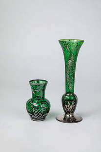 Two vases with silver plating: Two vases with silver plating, Bohemia, c. 1910 Green glass with galvanized floral fine silver decoration. H. 10 or 20.5 cm.Zwei Vasen mit Silberauflage Böhmen, um 1910 Grünes Glas mit