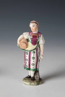 Beer Girl: Beer girl Probably Ludwigsburg, around 1800 Standing on a flat round pedestal and holding a small beer barrel and a small jug in his hands. Colourfully staffed. Unmarked. H. 11 cm.
