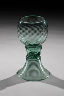 Roman: Roman German, 18th century Green glass with tear-off. Trumpet-shaped spun foot. Shaft open at the top with three appliquéd berry nubs. Below the oblique optically blown cuppa, a pinched ribbon