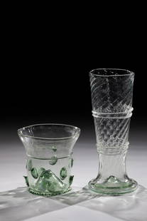 Pole and Krautstrung: Pole and herb strut 20th century. Light green glass with tear-off. Rod with oblique optically blown wall and applied threads. Strunk with pinched stand ring and two rows of offset applied nubs. H. 9