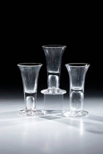 Mixed lot of three police officers: Mixed lot of three constable North German, 18th century Colourless glass with tear-off. Disc base. hollow shaft merging into trumpet-shaped cuppa. Engraved calibration mark ''0.08 L''. H. approx. 13 c