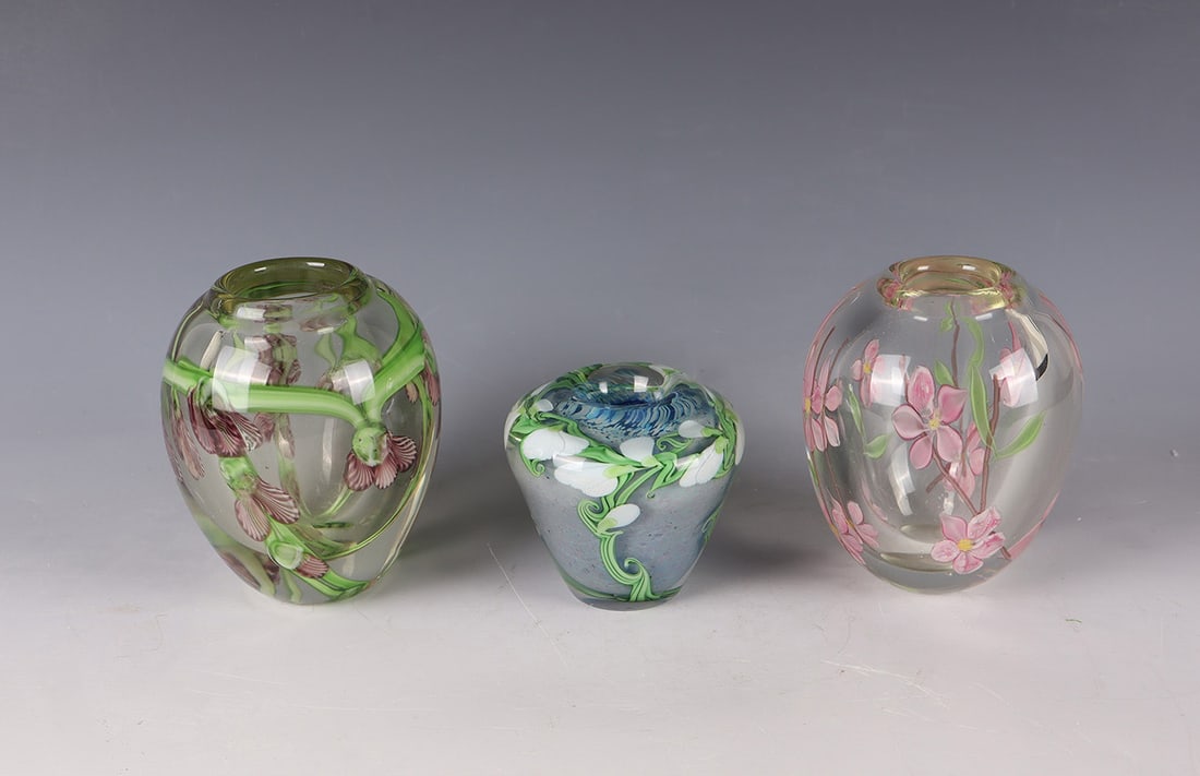 Three Vases: Three vases, including Bruce Sillars (design), Orient & Flume, 1983 Colourless glass. multi-coloured, floral décor between the layers. A vase under the stand signed and numbered: Orient & Flume B. Si