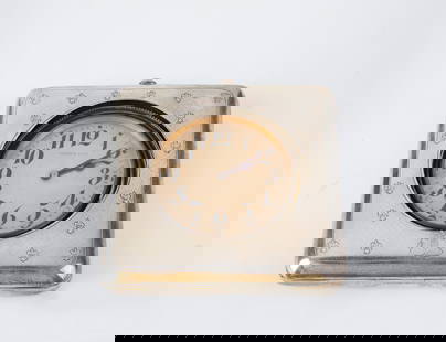 Travel Clock: Travel watch around 1900 silver, brass. On the round dial, Arabic numerals and the inscription ''SHREVE & CO''. Collapsible sheath frame with stand, punched background and heraldic lilies engraved. Mo