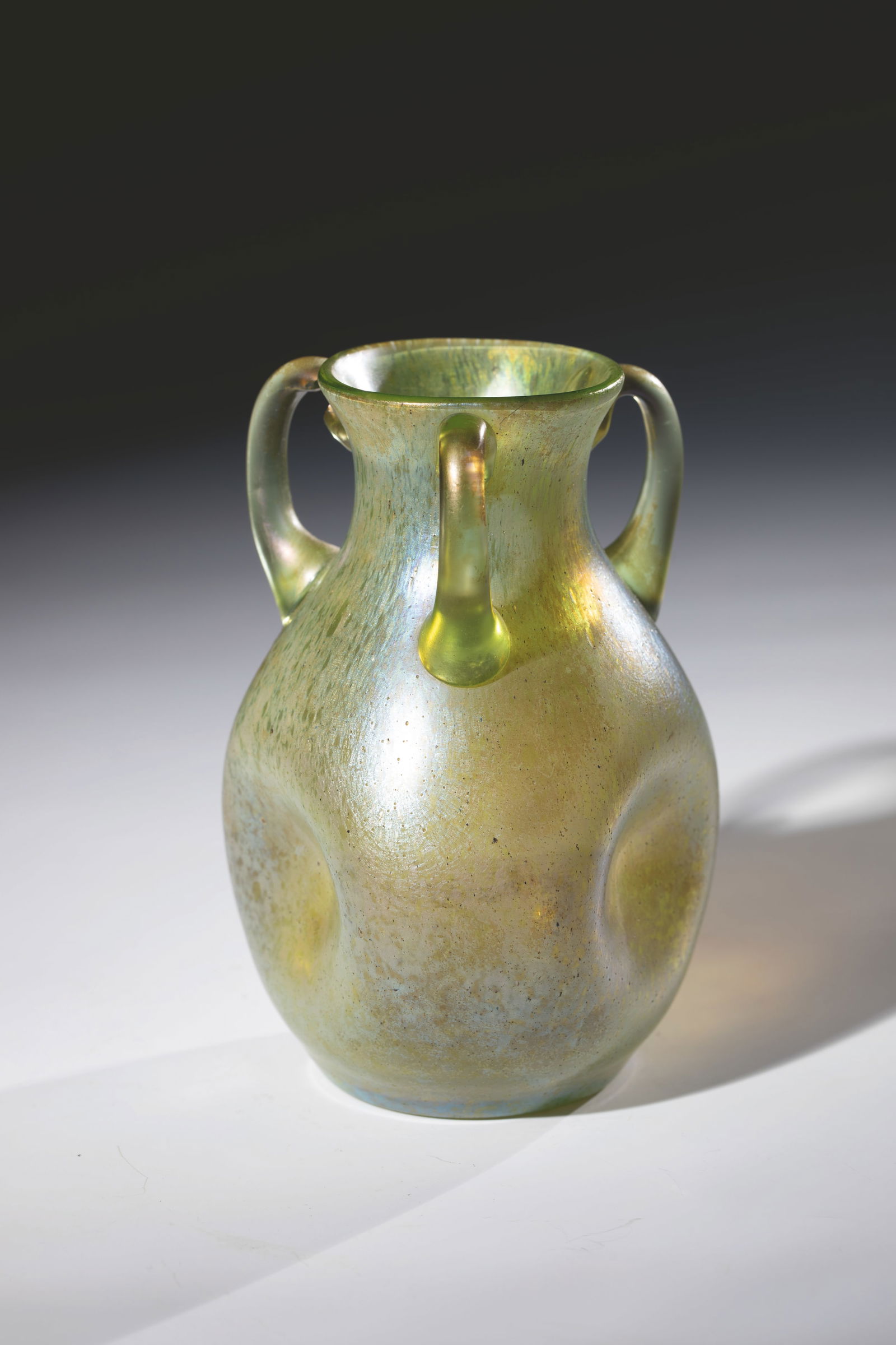 Decorative Handle Vase ''creta Papillon'': Ornamental Handle Vase ''creta Papillon'' Loetz Wwe., Klostermühle, c. 1899 Green glass with silver-yellow crumble melting. Muzzle triple wavy and three appliquéd handles below the muzzle. Matt irid