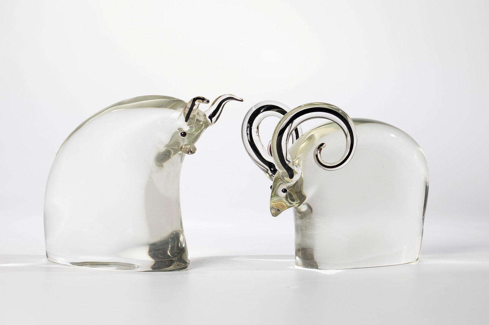 Two animal figures ''ram and bull'': Two animal figures ''Ram and Bull'' Antonio da Ros (design), Cenedese, Murano, 1968 Colourless glass. The horns each with a black-violet underlay. Appliquéd eyes made of black-violet glass. Biomorphi