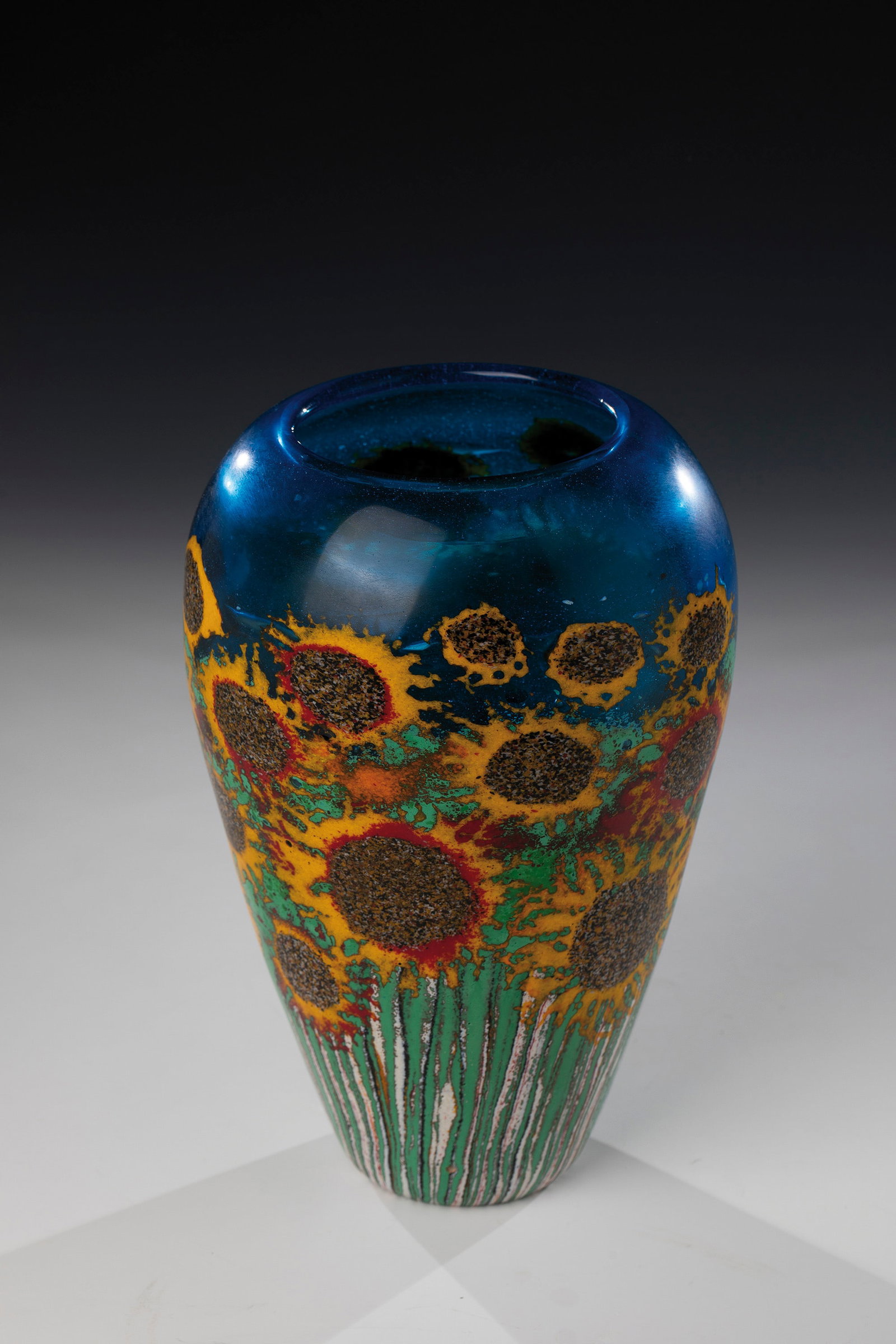 Vase ''Floreali con girasoli'': Vase ''Floreali con girasoli'' Lorenzo Tartari ''Marty'' (design), Bruno Fornasier (execution) for Fratelli Toso, Murano, 1983 Aquamarine blue glass. Circumferential décor on the wall: sunflower moti