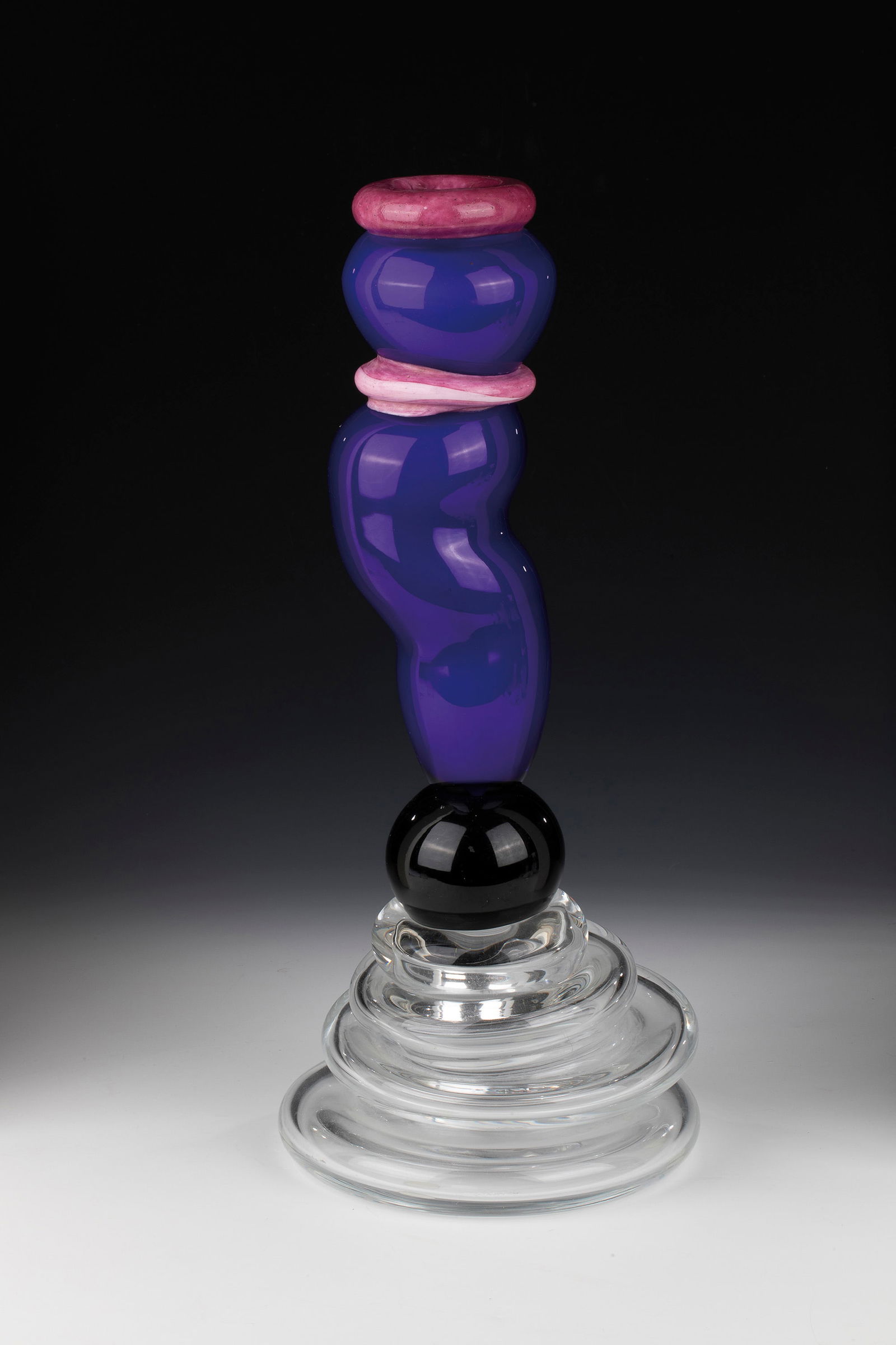 2-part object: 2-part object Peter Shire (design), Vistosi, Murano, c. 1980 Colourless, black-violet, blue glass underlaid with white opal, partly with pink crumb melting. Freely formed and fused together. Underside