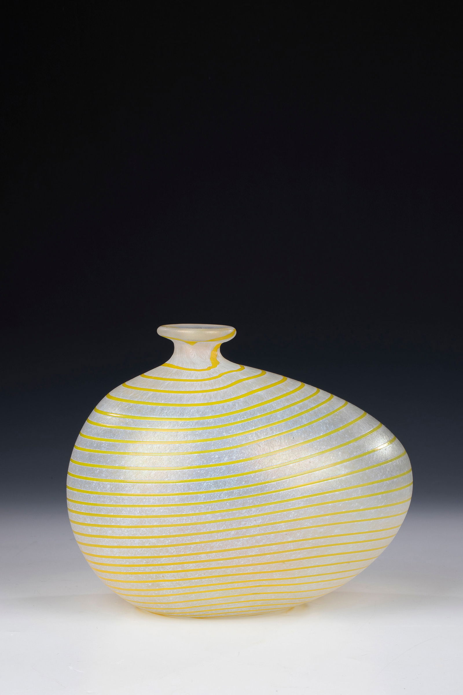 Vase: Vase Bertil Vallien (design), Kosta Boda Colourless glass with white crumb melting. Spiral-shaped, yellow glass thread. Iridescent. Underside inscribed in engraving: KOSTA BODA ARTIST COLL B. VALLIEN
